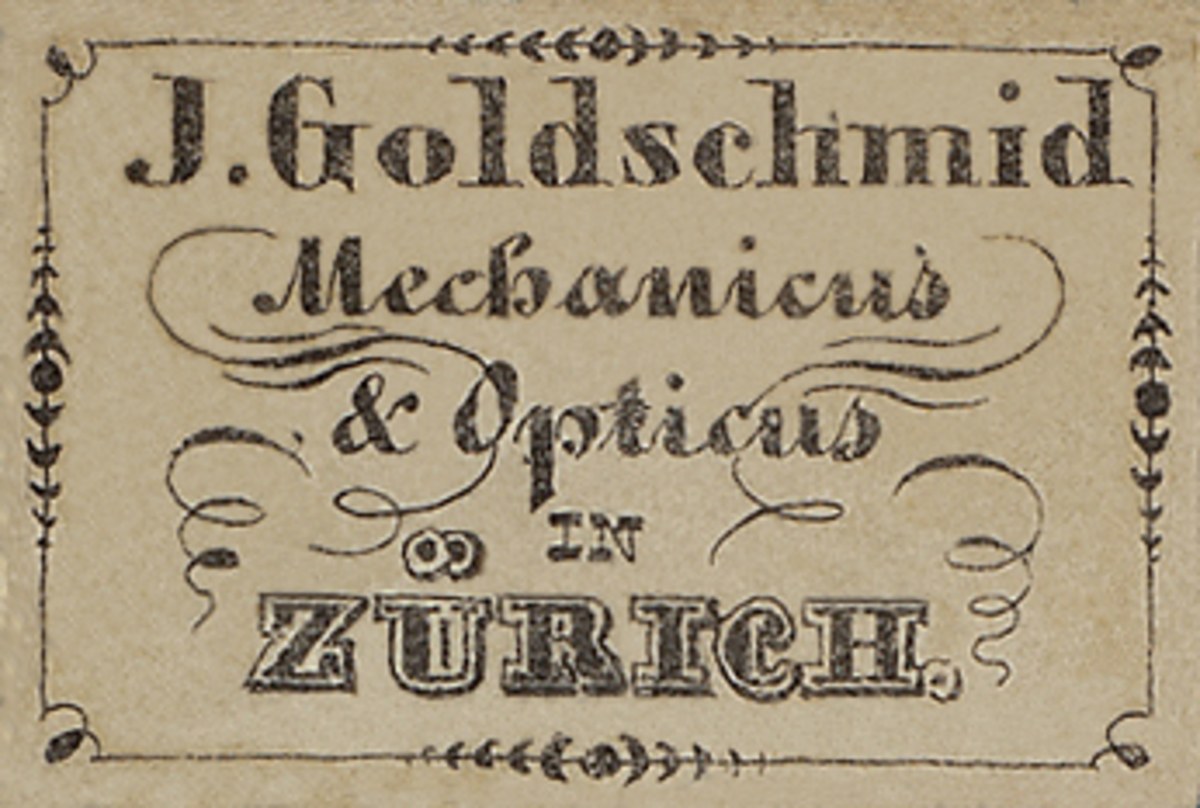 Alte Visitenkarte für "J. Goldschmidt Mechanicus & Optik in Zürich", likely aus dem frühen 20. Jahrhundert, mit der Aufzählung der Unternehmensdienstleistungen.