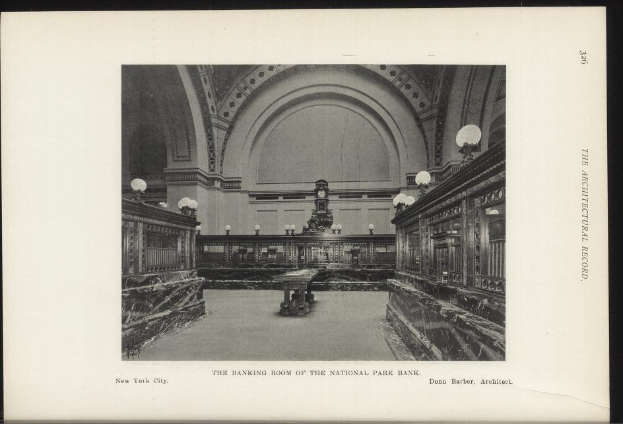 Schwarzes und weißes Foto des Banketts des National Park Bank in New York City, das Tische, Lampen, eine Wanduhr und Text am unteren Rand zeigt.