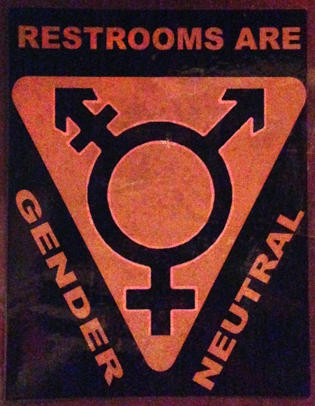 Plakat mit dem Text "Toiletten sind geschlechtsneutral" betont die Geschlechtergerechtigkeit in Toiletten.