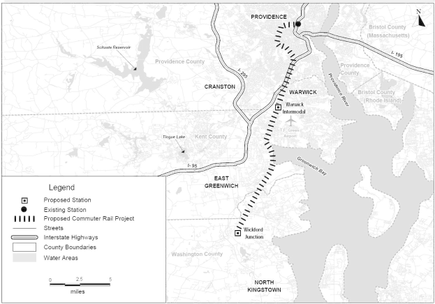 Schwarz-weiß-Stadtplan mit einem Fluss, beschriftet mit "Vorgeschlagenes Pendlerbahnprojekt", zeigt Straßen, Autobahnen und Stadtmerkmale.