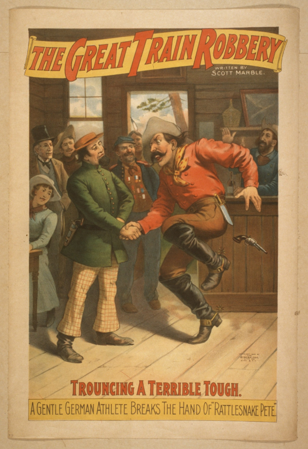 Plakat zeigt eine Gruppe von Menschen auf einem Boden mit einem, der eine Waffe hält, ein Fenster und eine Wand im Hintergrund und den Text "Die große Zugüberfall - Trouching ein schreckliches Ding" oben und unten.