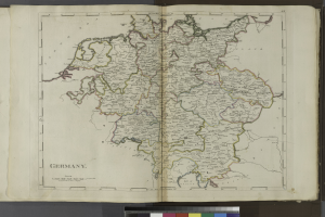 Ein aufgeschlagenes Buch mit einer detaillierten Karte von Deutschland und seinen Bundesländern und Städten, begleitet von beschreibendem Text.